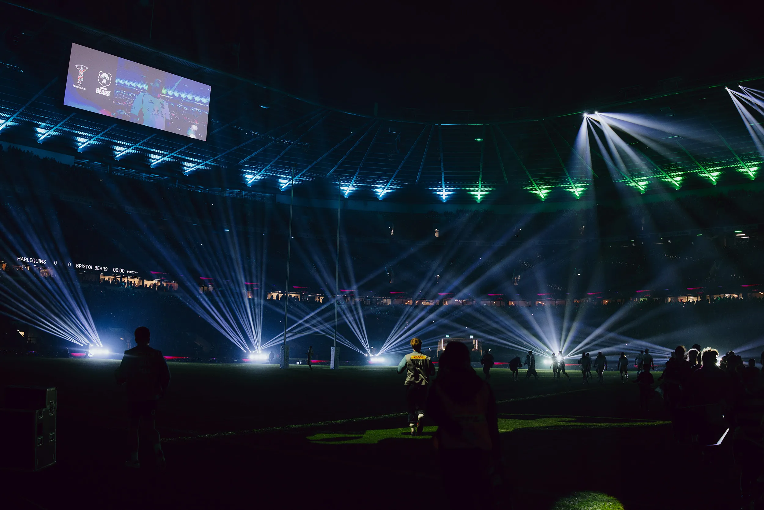 Beams fan across the darkened stadium bowl during the show at Twickenham