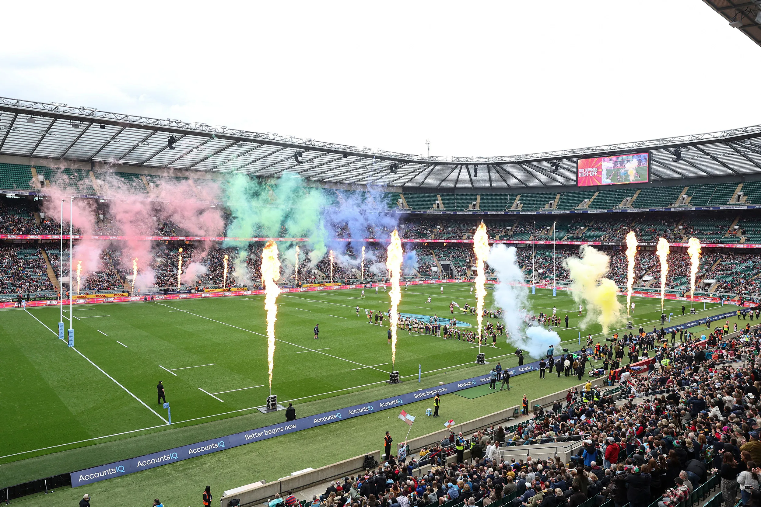 Flame jets and plumes of coloured smoke along the pitch as the teams walk out