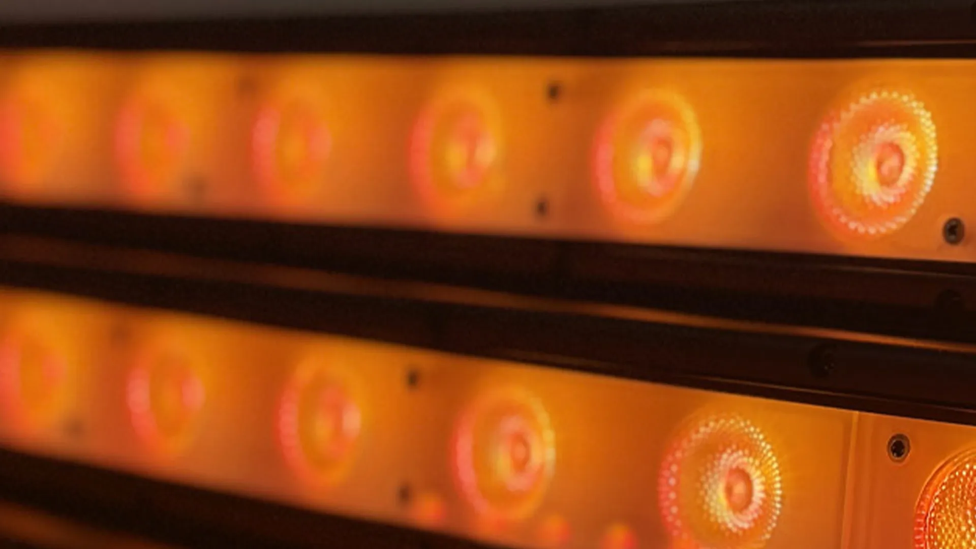 Zeal dry-hire kit racked and ready in the warehouse, lit orange.