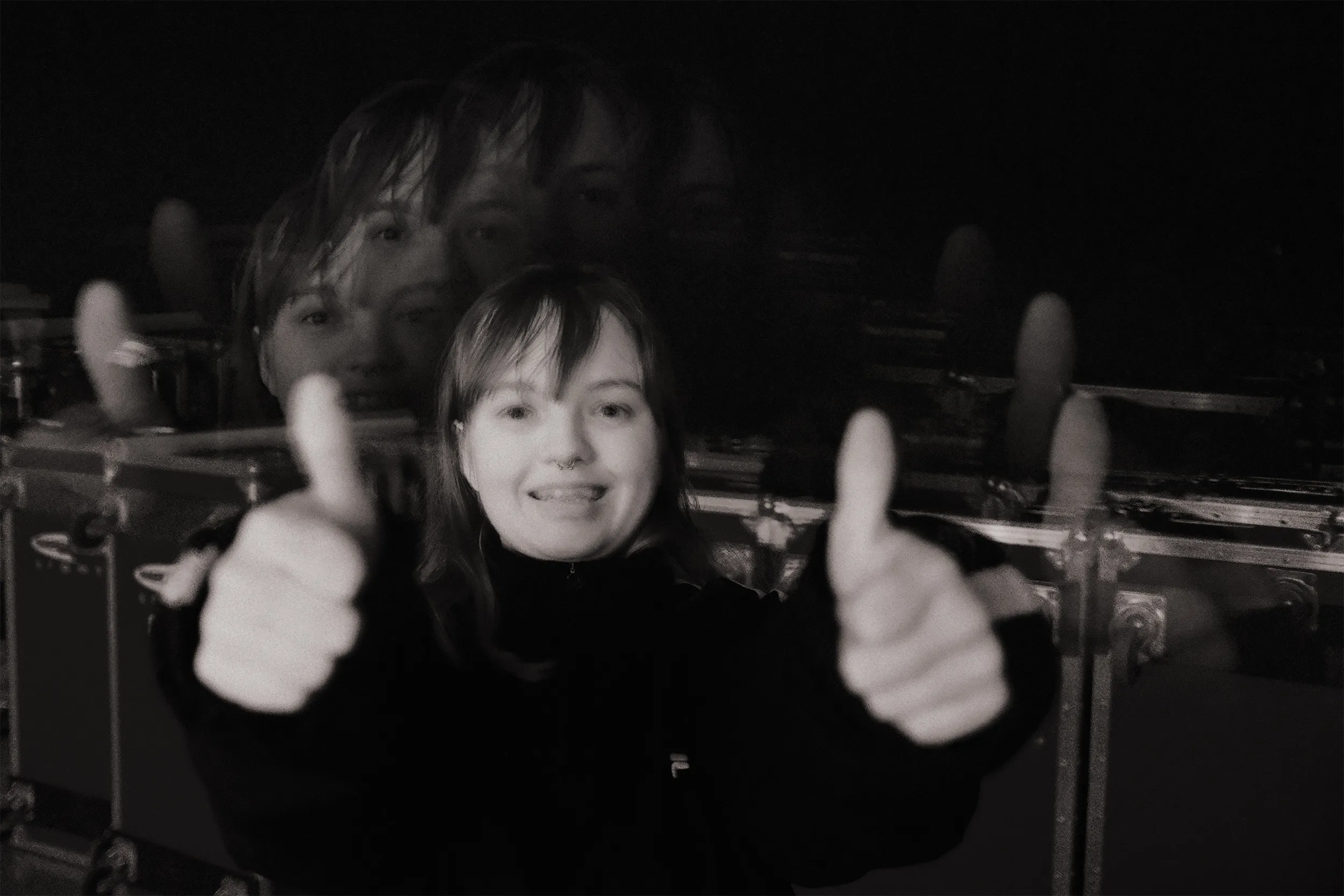 Holly, giving a thumbs up.