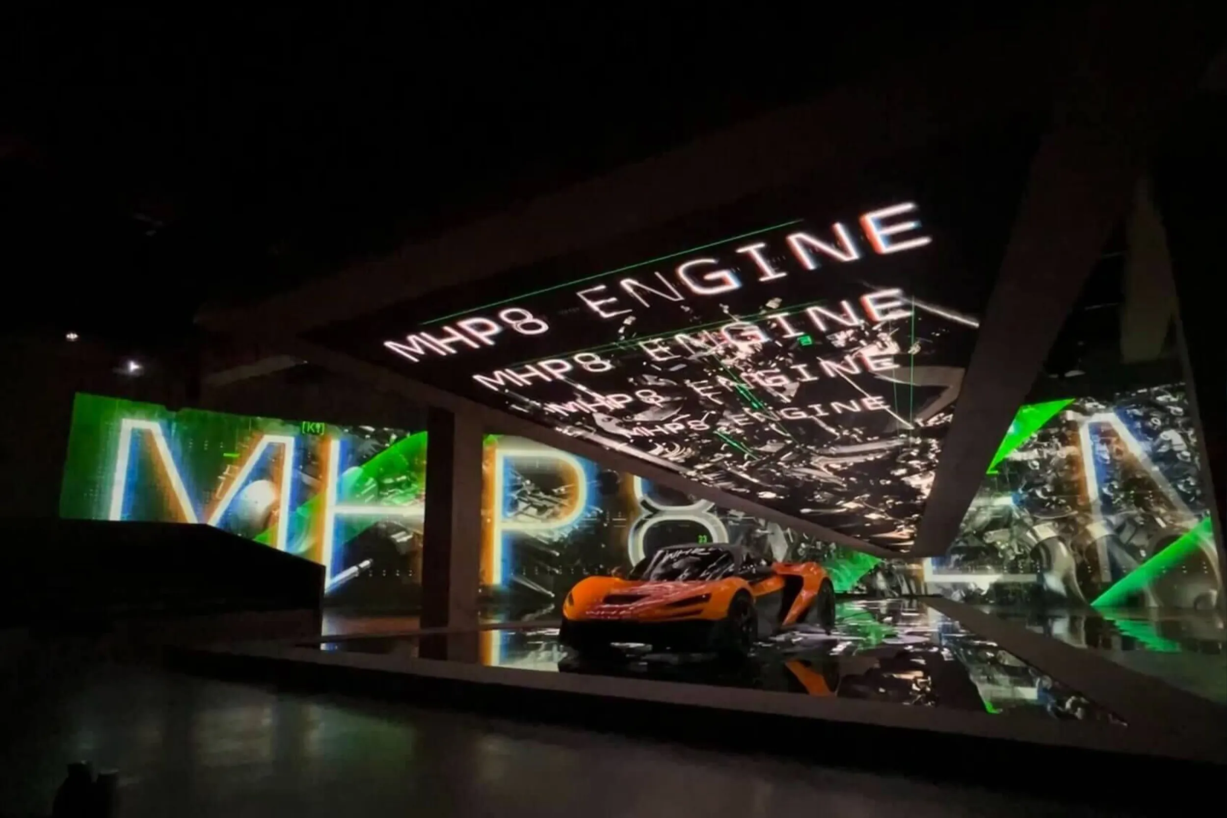 MHP8 engine visuals in white and green across the canopy and walls above the car