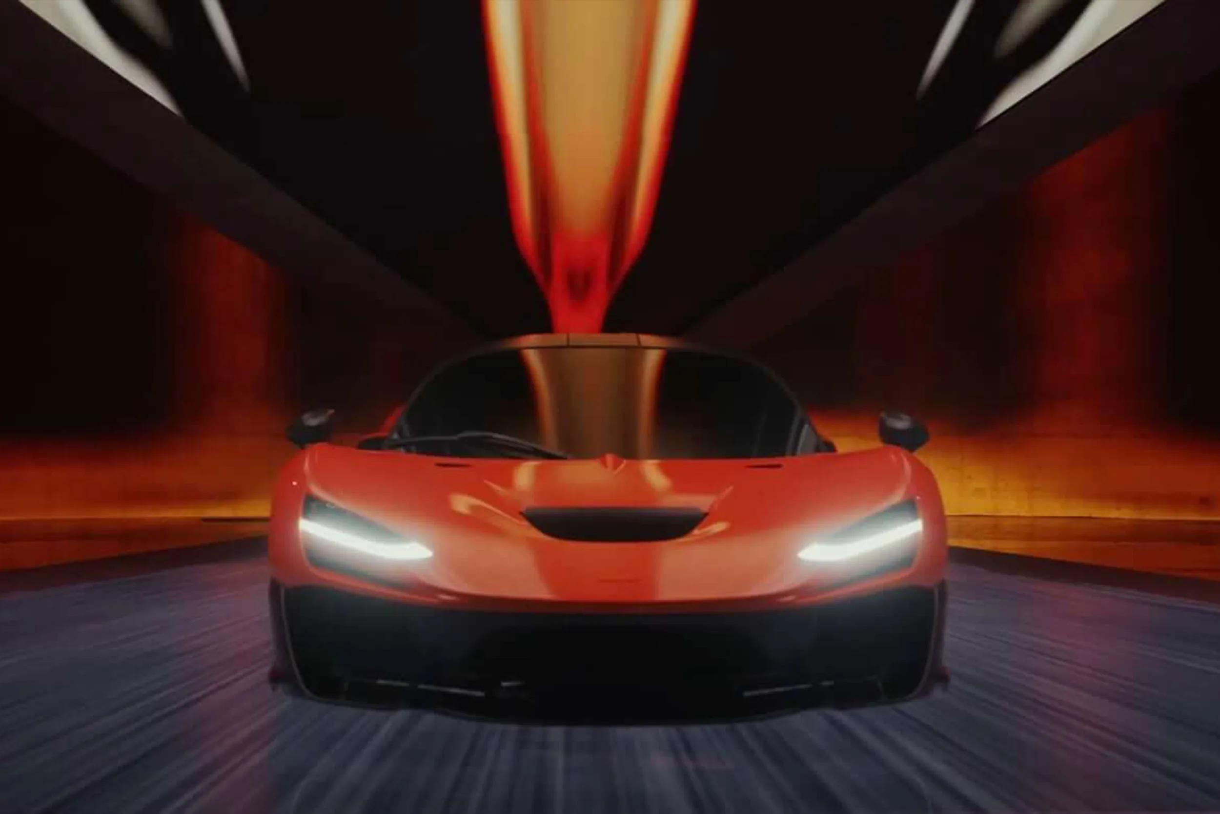 The car head-on with orange light streaking down the tunnel towards it